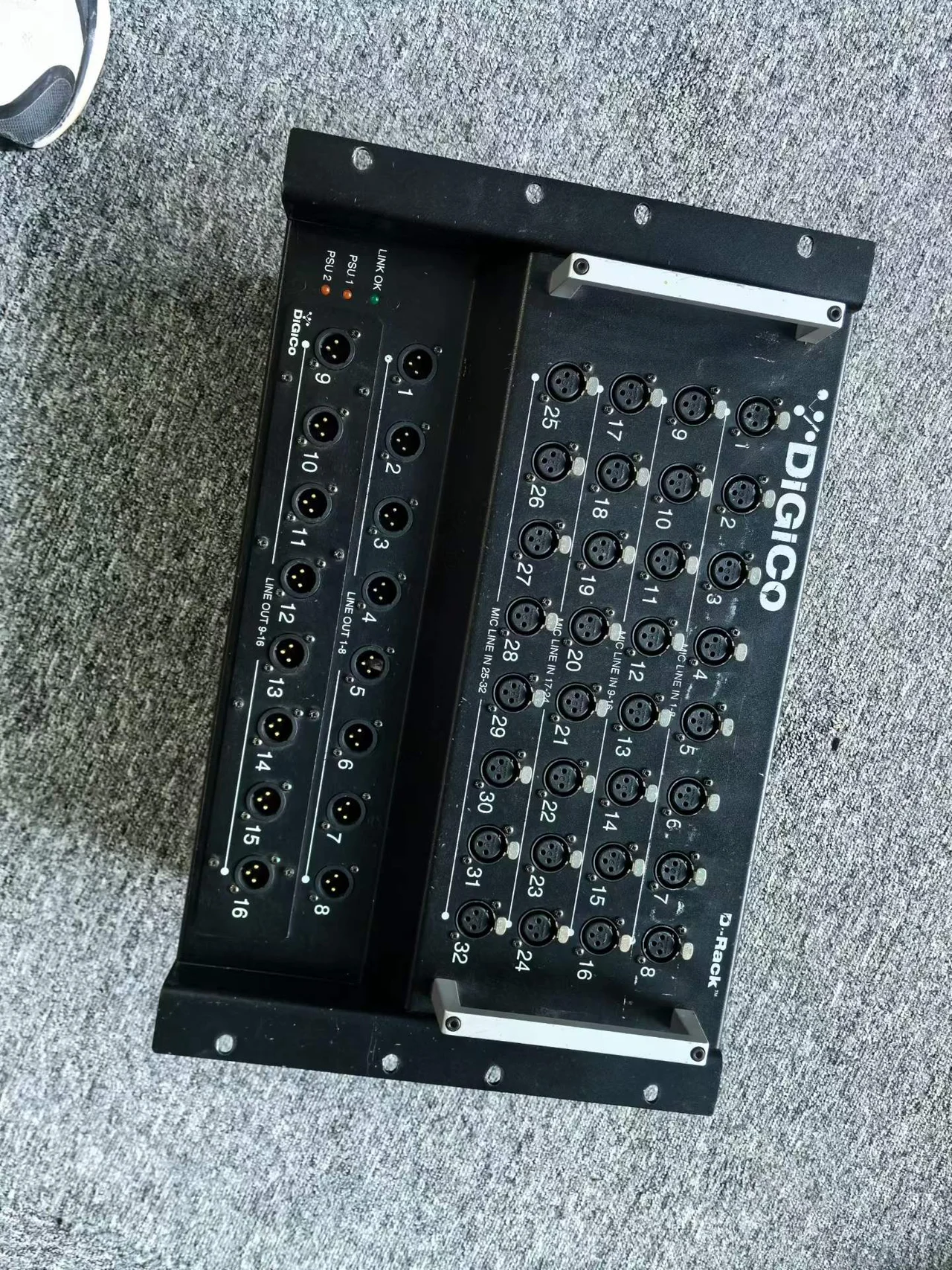 Supplied photograph showing the front of a DiGiCo D-Rack-labelled stage interface — photograph 1