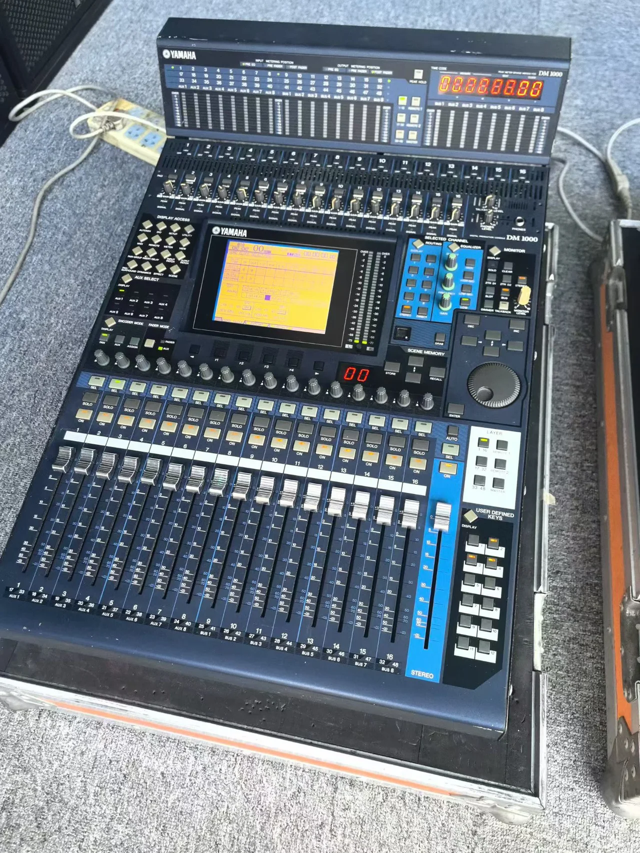 Supplied photograph showing a Yamaha DM1000-labelled console and meter bridge — photograph 1