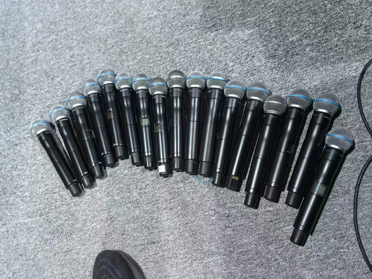 Supplied photograph of Shure UHF-R handheld components; identity and availability require confirmation — photograph 2