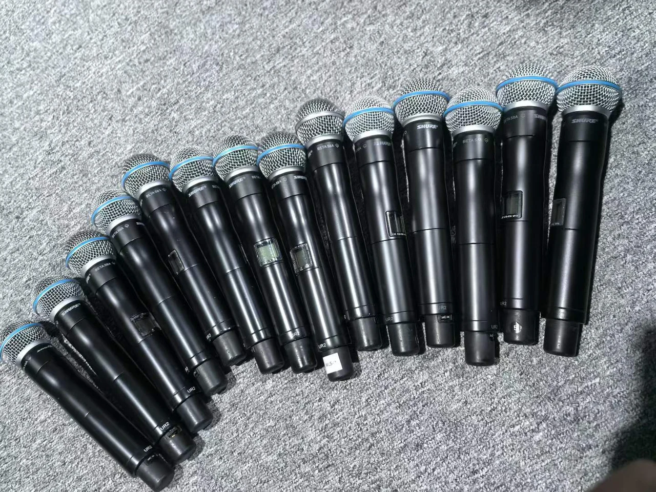 Supplied photograph of Shure UHF-R handheld components; identity and availability require confirmation — photograph 3