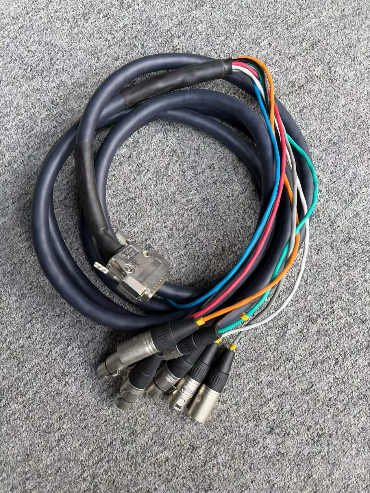 Supplied photograph of Unbranded / to confirm DB25 to XLR loom; identity and availability require confirmation — photograph 1