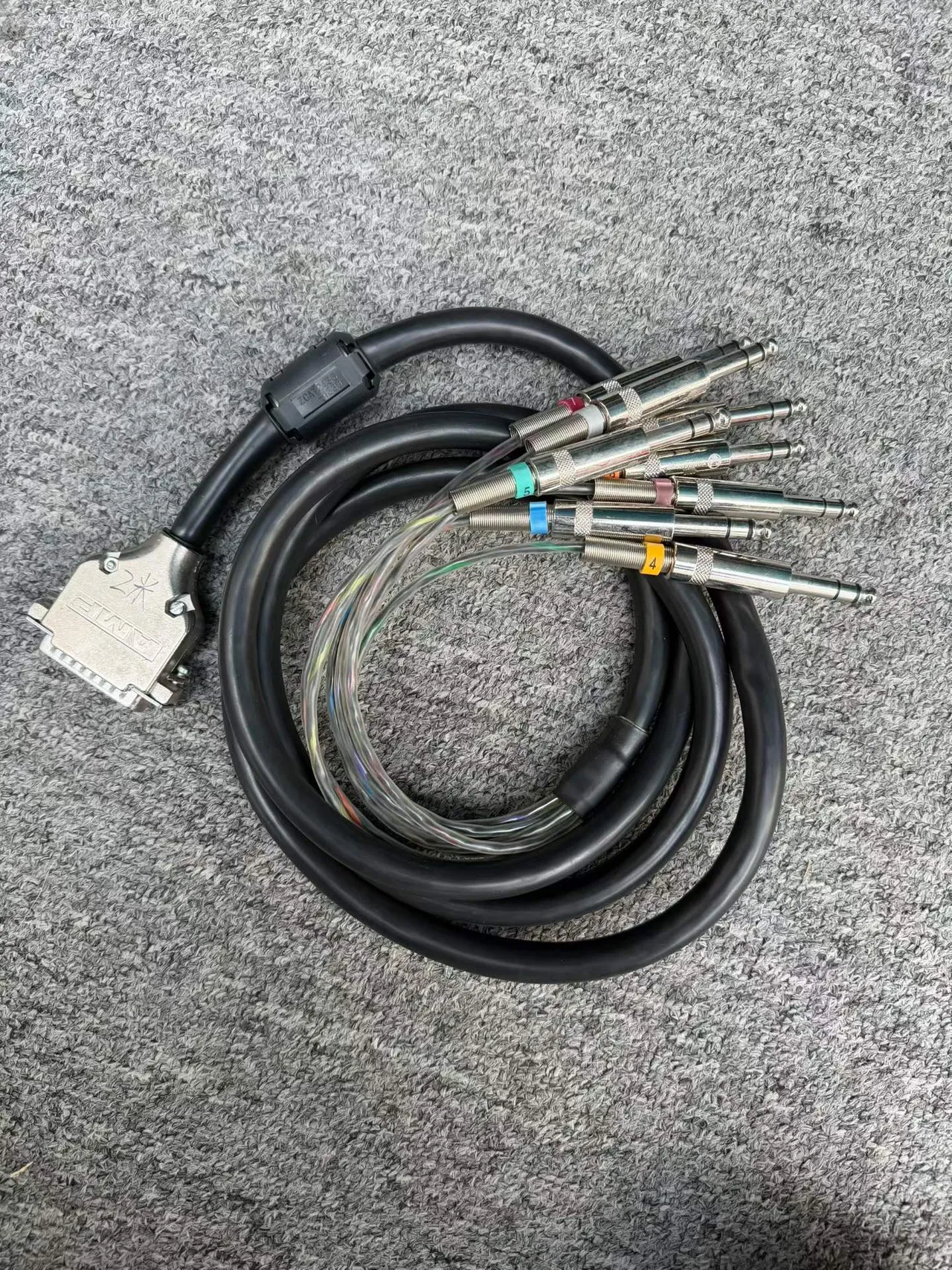 Supplied photograph of Unbranded / to confirm DB25 to XLR loom; identity and availability require confirmation — photograph 1