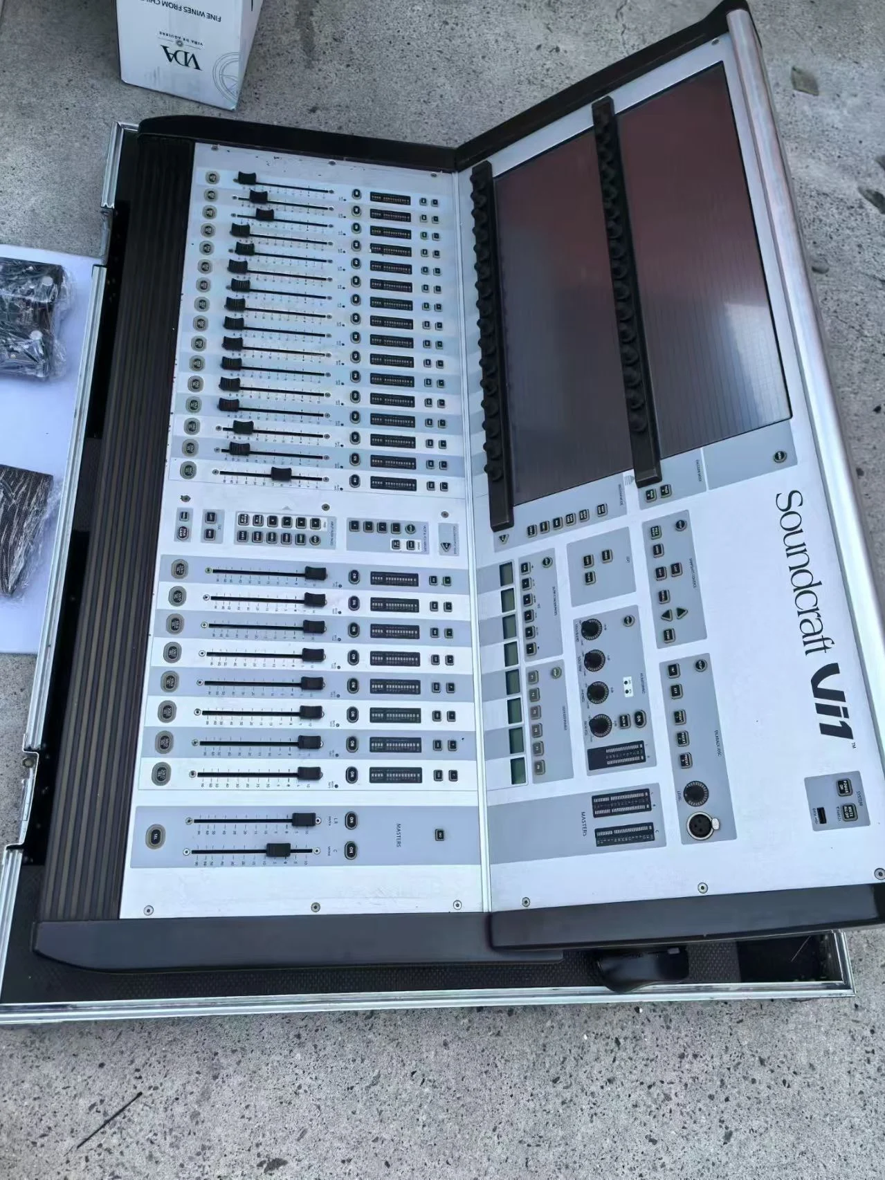 Supplied photograph showing a Soundcraft Vi1-labelled console in a case — photograph 2